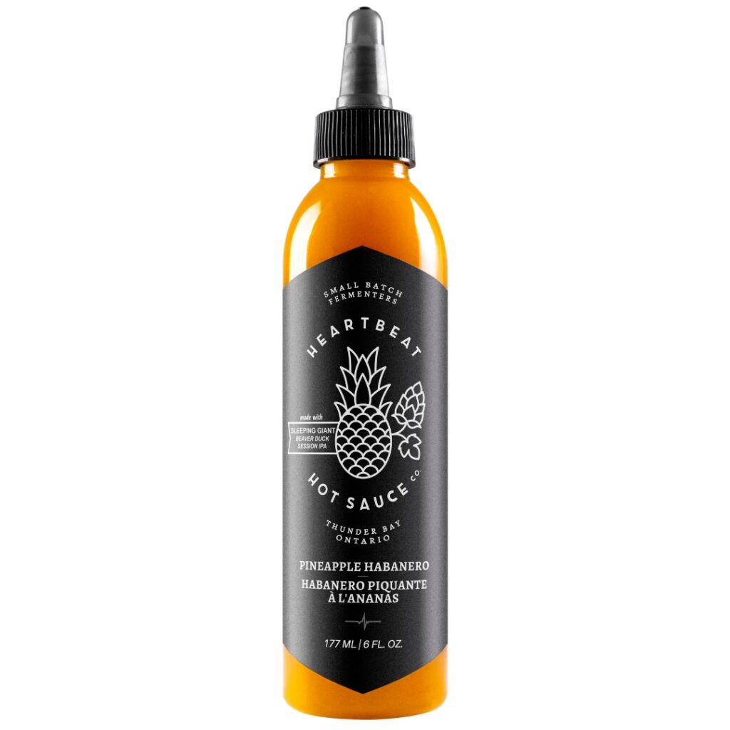 As seen on Hot Ones Season 10, Heartbeat’s Pineapple Habanero hot sauce blends fresh pineapple, habanero heat, and Ontario craft beer for a vibrant, fruity kick. Small-batch and all-natural, it’s perfect for BBQ, Indian snacks, desserts, and tropical cocktails. A gourmet, versatile sauce with a clean, spicy finish.