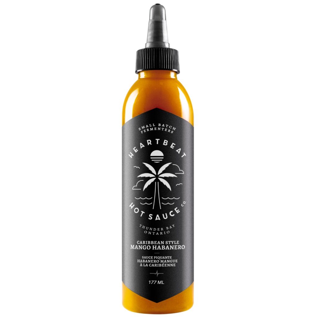 Discover the bold, tropical fusion of juicy mangoes and fiery habaneros in Heartbeat’s Mango Habanero hot sauce. A cult-favorite Caribbean-style sauce made in small batches with clean, natural ingredients—perfect for BBQ, Indian snacks, desserts, and cocktails. Sweet, spicy, and unforgettable.